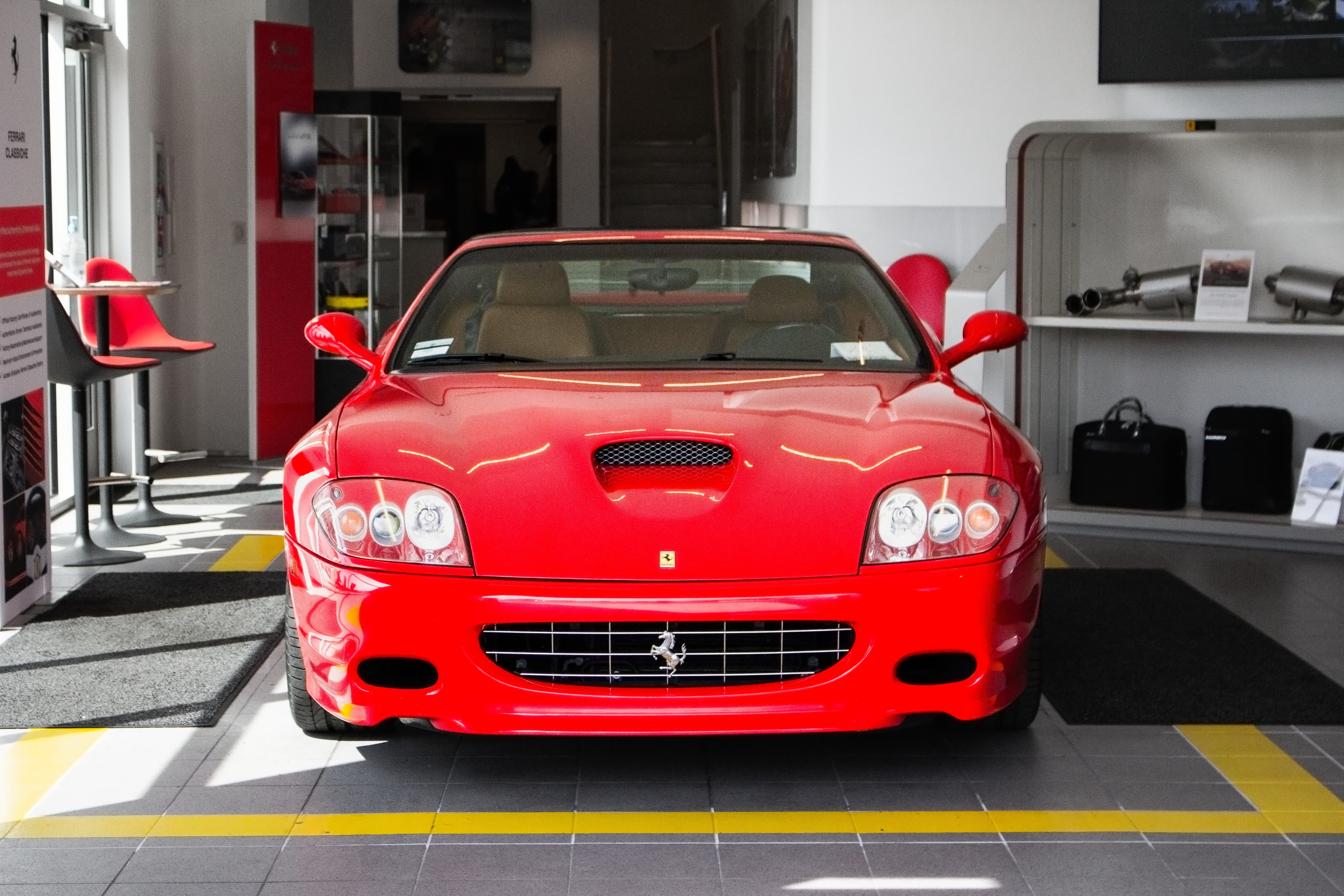 A Photograph of a Ferrari in a Workshop